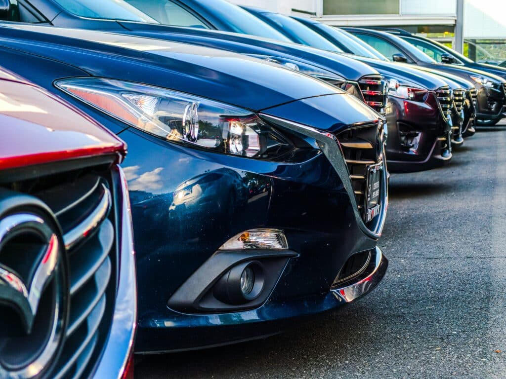 A view of cars parked in a line