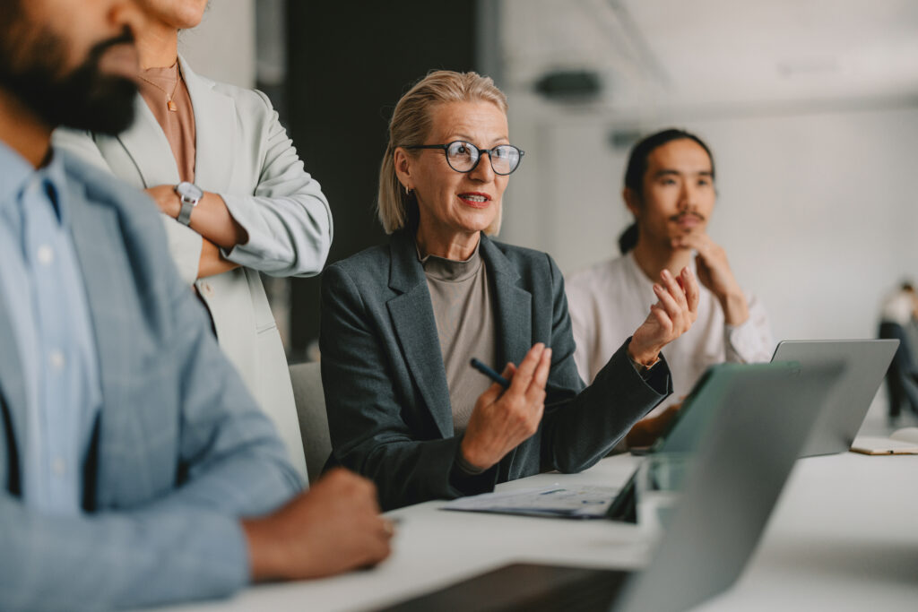 A woman speaks in a business meeting.